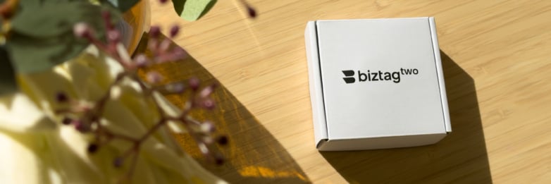 Biztag Two product packaging on a wooden table