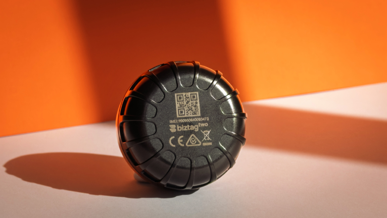 Biztag Two BLE tracking device on orange background