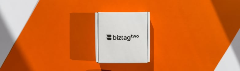 Biztag Two white packaging on an orange background