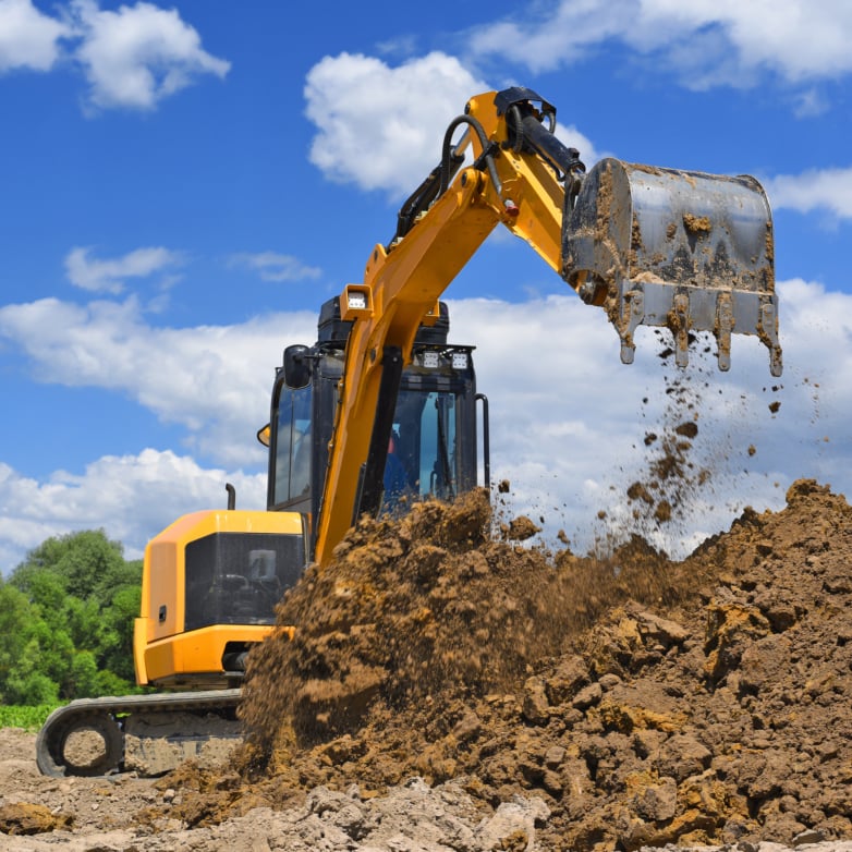 Yellow excavator digging on construction site